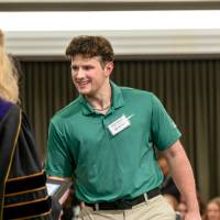 shaking hand with faculty